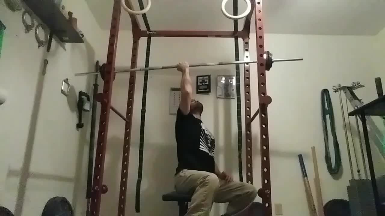 Reverse grip seated one arm barbell shoulder press