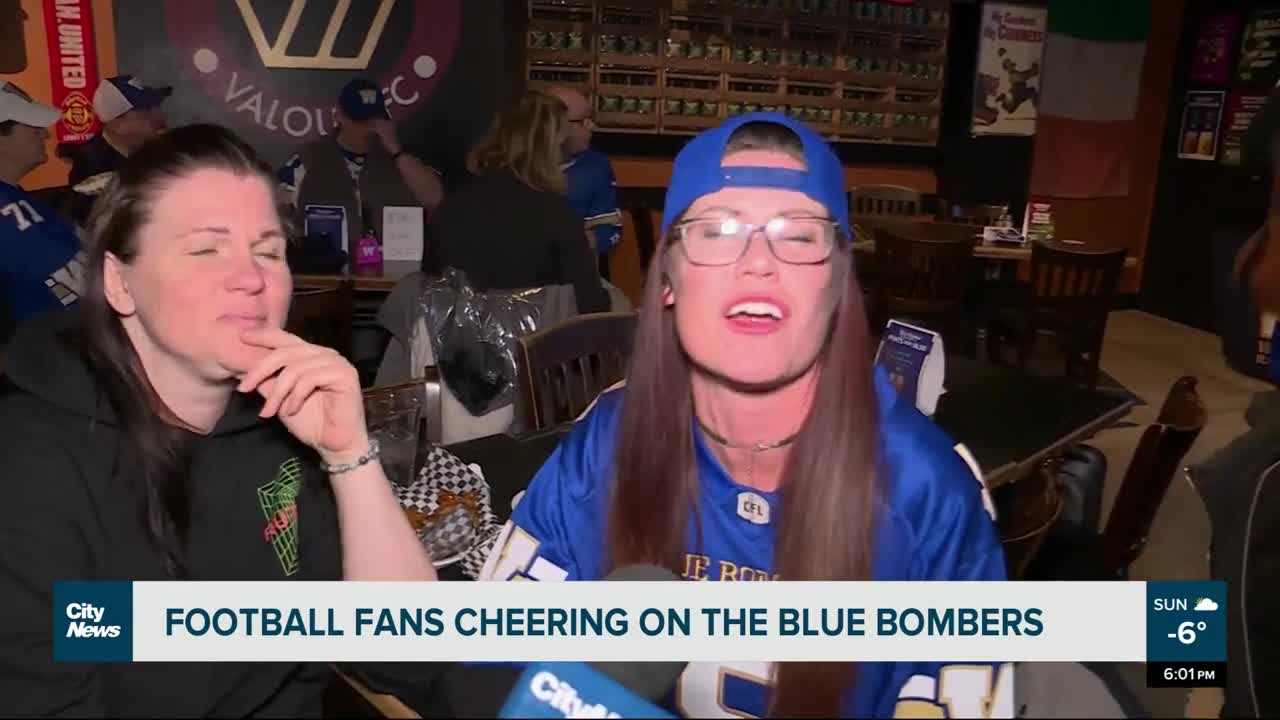 Football fans cheering on the Blue Bombers