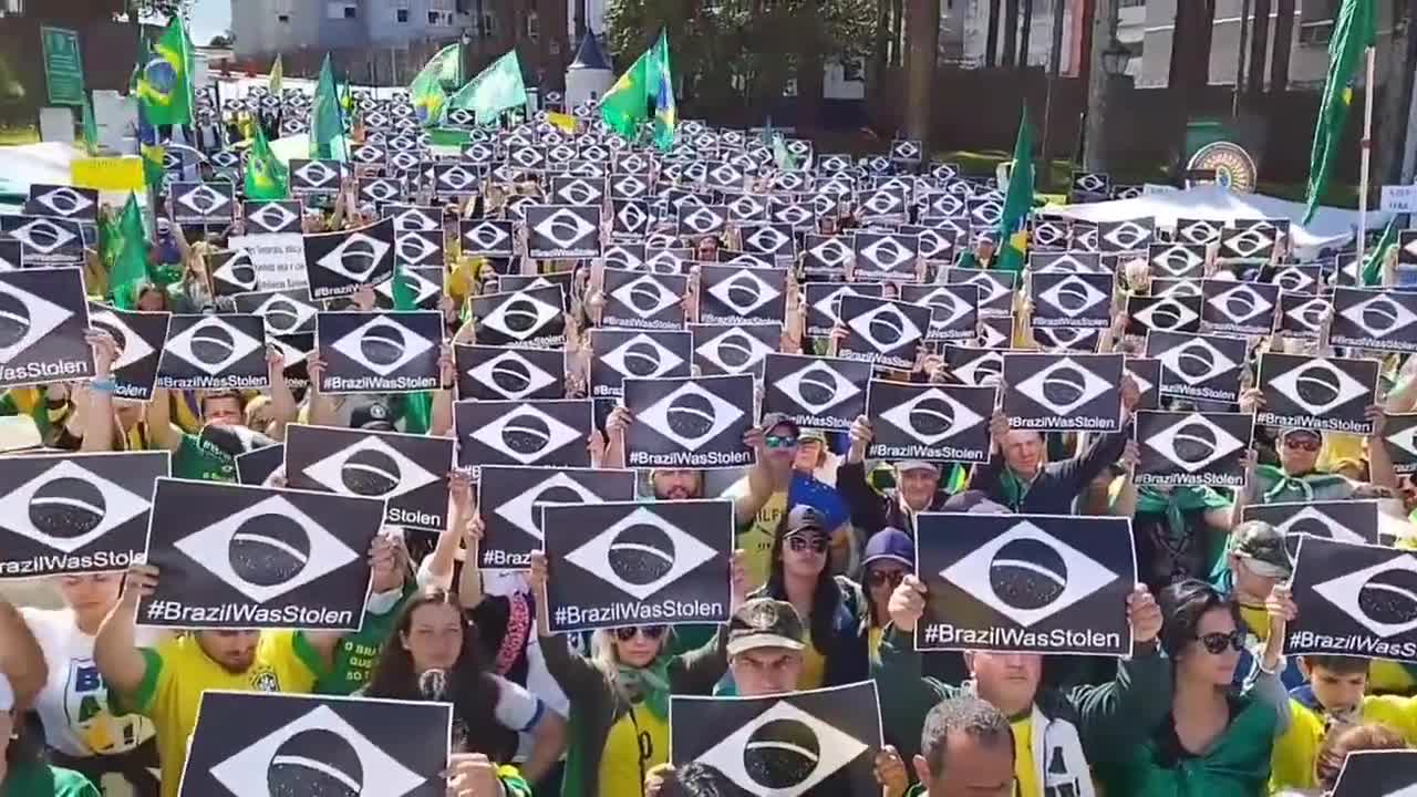 Brazilians still in the streets holding signs that read "Brazil was stolen"