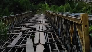 Scooter Crosses Sketchy Bridge