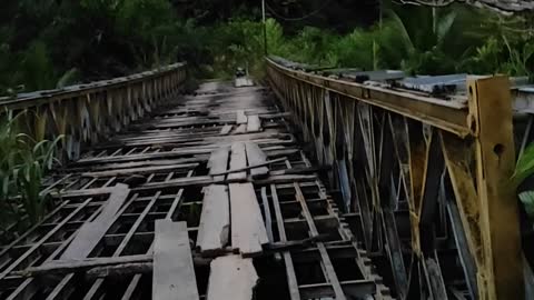 Scooter Crosses Sketchy Bridge