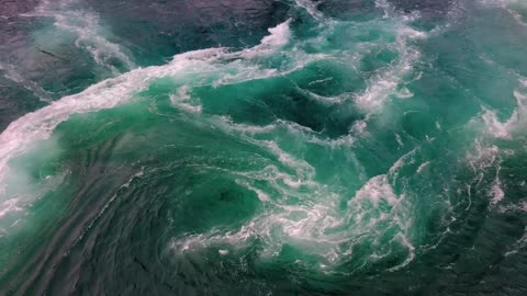 waves of water of the river and the sea meet each other during high tide and low tide whirlpools