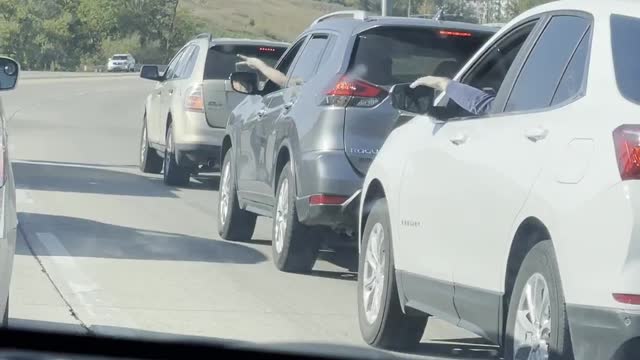 People Stuck at Red Light Play Rock Paper Scissors