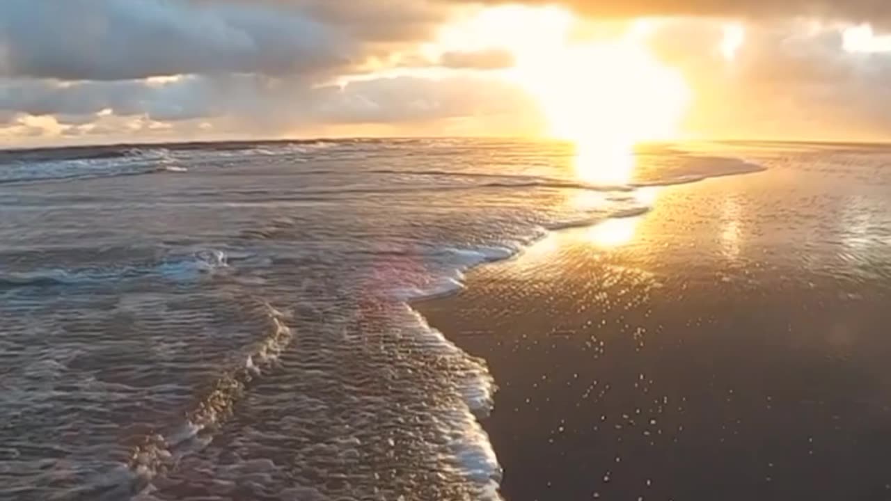 The beautiful clouds, the shining sun and the lovely waves of the sea