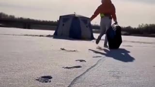 Girl fishing in a frozen pond