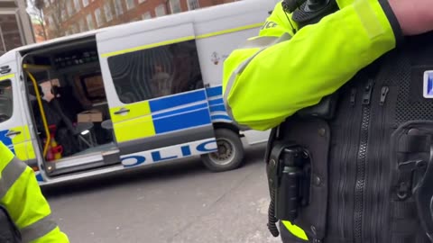 A man carrying a “HAMAS ARE TERRORISTS” sign….is arrest and dragged to the floor by the met police