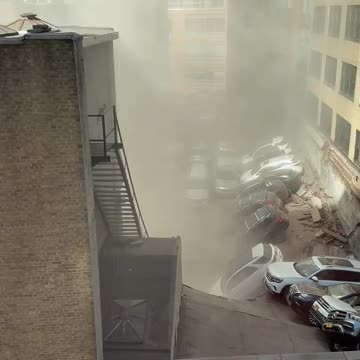 Parking garage collapse reported in Lower Manhattan, New York City; several people trapped