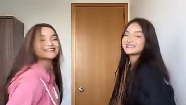 Cute dancing twins