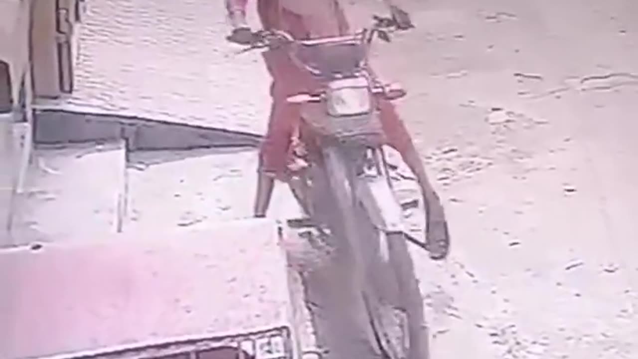 A little girl is stealing a bike