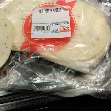 Eating Hot Pepper Cheese, Dearborn Italian Bakery, Ford Rd, Dbn, MI, 10/26/23