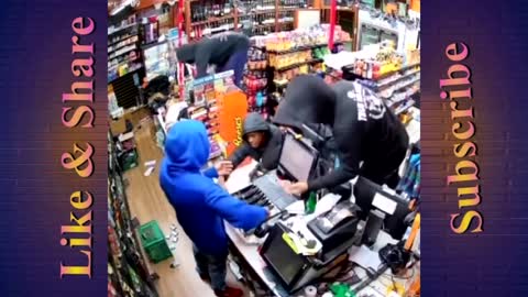 Thieves storm Grocery in Oakland, California. shop attendant does Nothing only stares at his phone