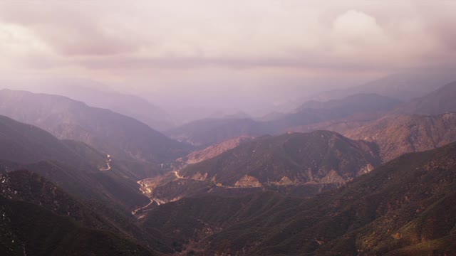 Timelapse Of Mountain Range With Clouds Moving In Blue Sky In 4K