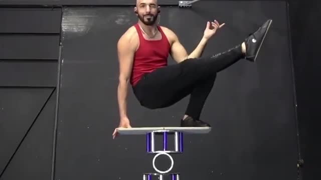 Circus Artist Shows Cool Balancing Trick on Rola Bola