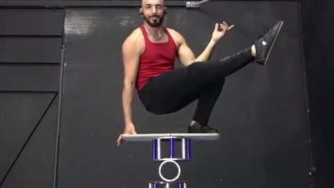 Circus Artist Shows Cool Balancing Trick on Rola Bola