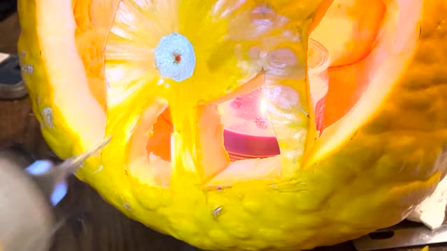 Carving A Cat's Rear End Into a Pumpkin