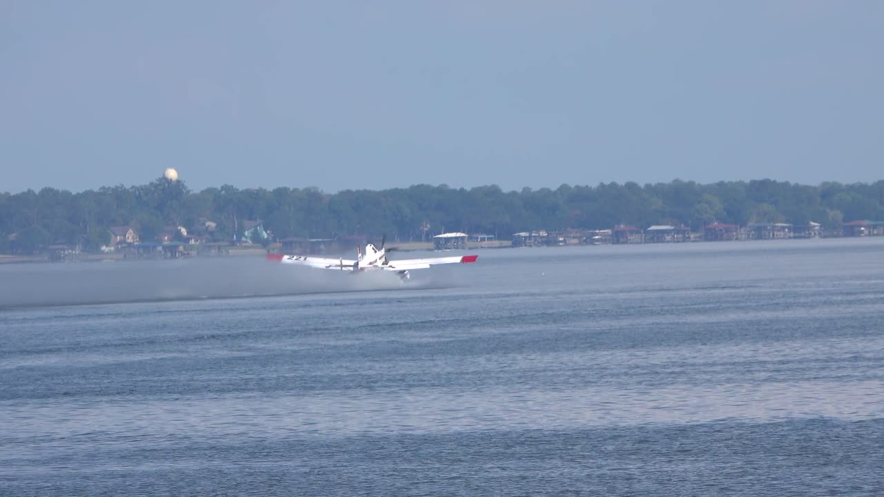 Fire Boss Plane scooping water Trinity Lake for walker County fire Huntsville Tx Sept 3 2023