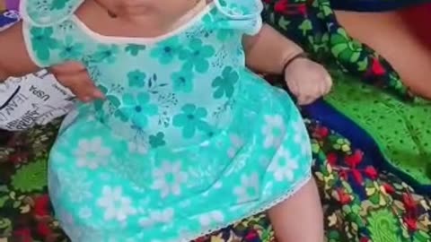 A gorgeous four-months-old infant with a beautiful smile