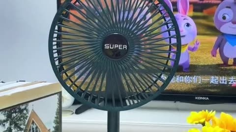 Small portable table fan with mobile stand and charging port