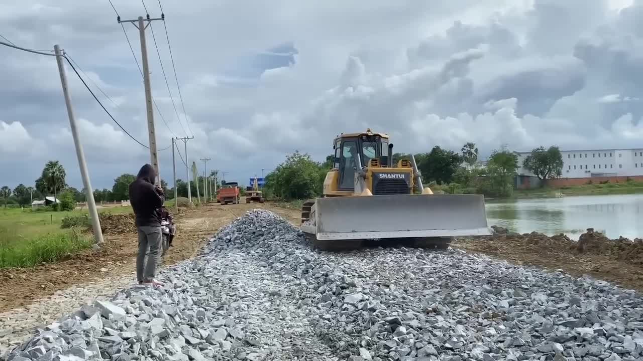 New bulldozer spreading gravel processing features building road foundation-15