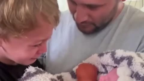 This little boy was meeting his baby sister for the first time