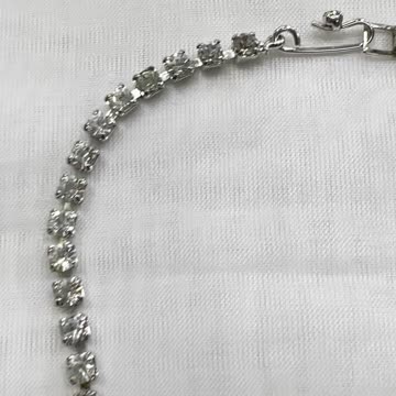 Rhodium Plated 15” Necklace + Earrings. Made with Swarovski Crystal. Bow Tie