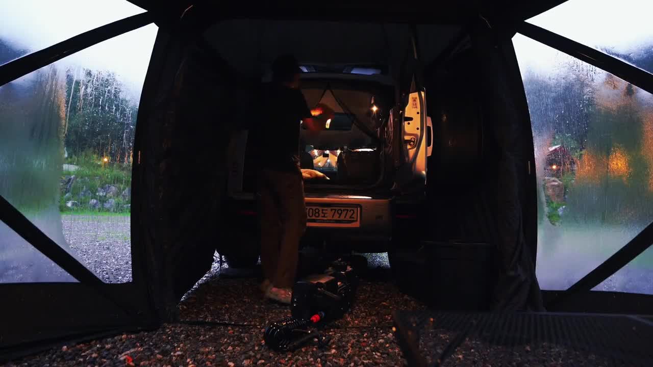 Self driving refined camping in the rain. It's only when you set up a tent in the rain that you feel