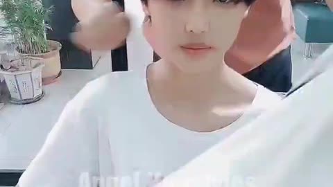 Beautiful girl long hair cut off in salon