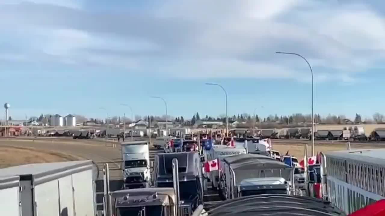 Massive convoy of truckers have blockaded the US-Canada border crossing in Alberta