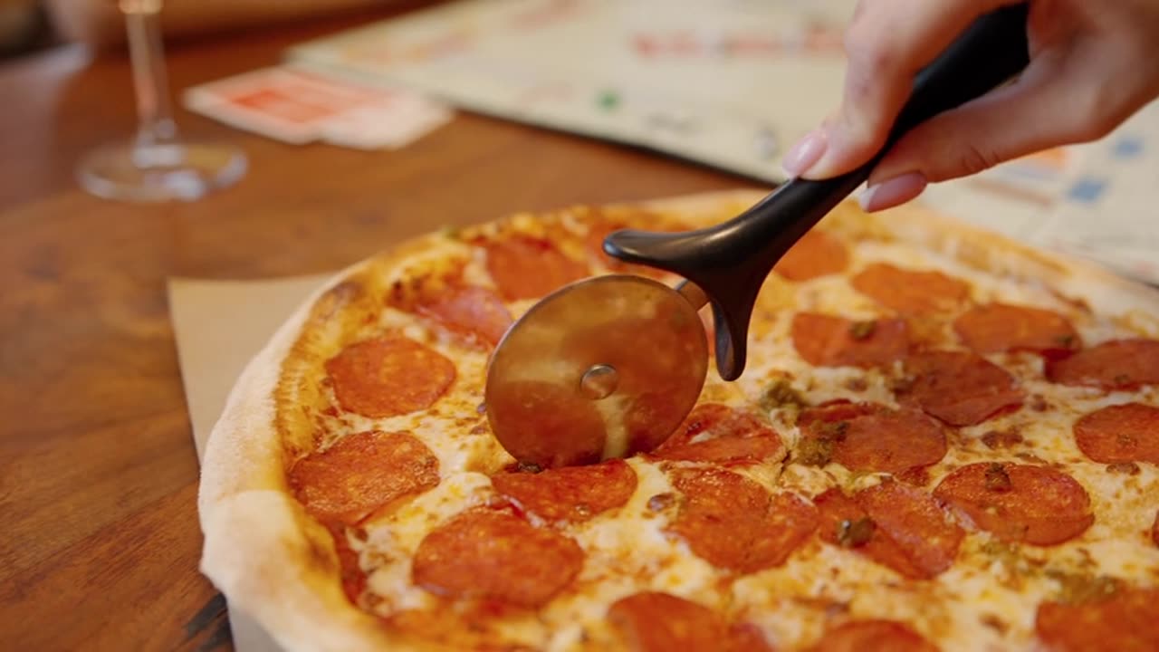 cutting pizza