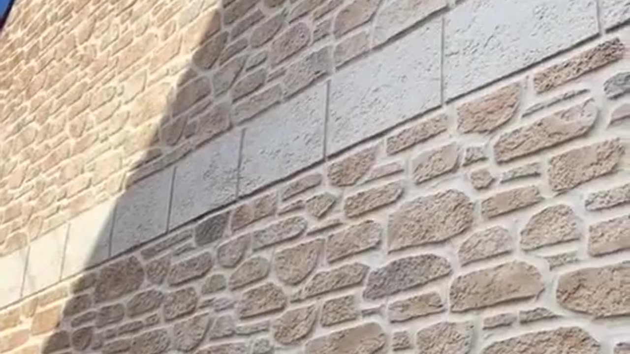 How a replica stone faced wall is carved.