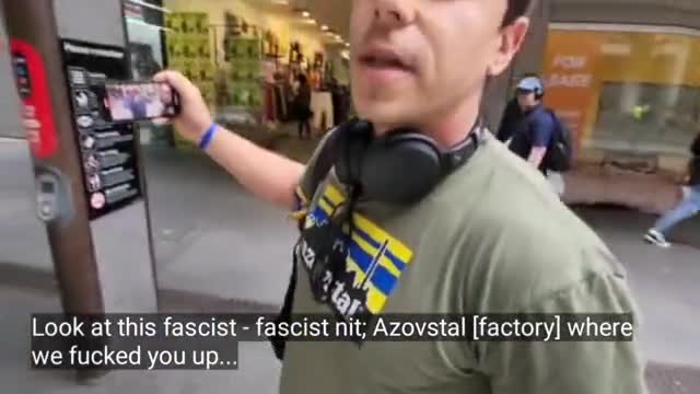 Protestor on the streets of Sydney, Australia appeals to the Western viewer