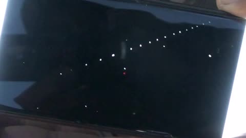 string of 17 lights move across sky in seconds