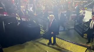 Man Appears To Throw Phone In Trump's Direction