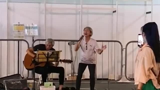 Elderly buskers surprised by viral fame, hope to spread joy with their songs