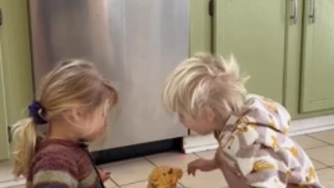 Loving siblings share tasty treat together