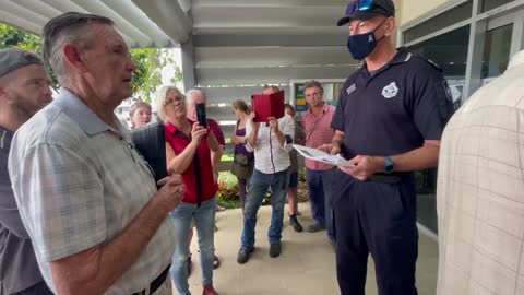 Mareeba police being served documents by the people