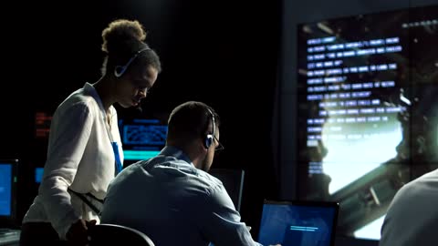 Scientist in flight control center