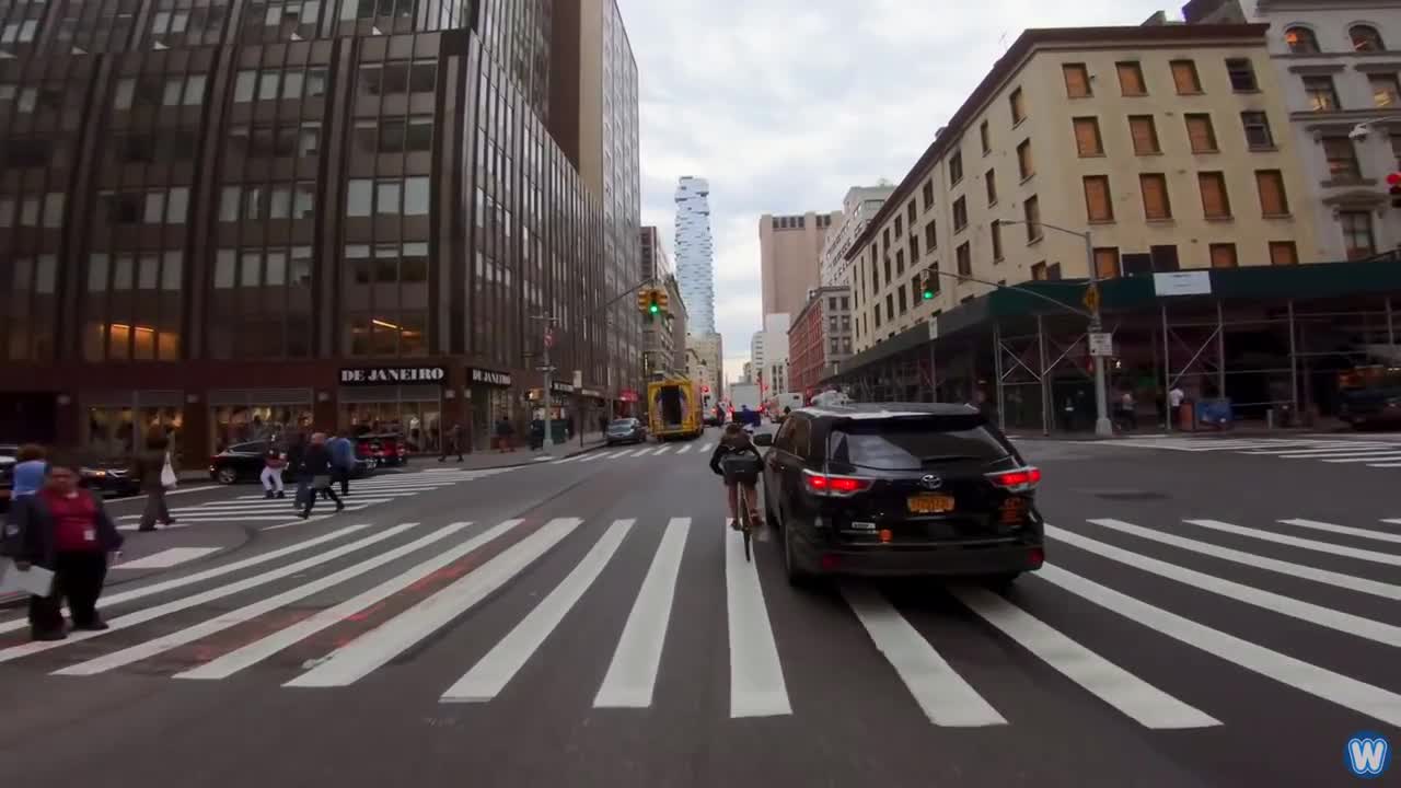 Bike Messenger Riding Fast and Fluid Through NYC Traffic