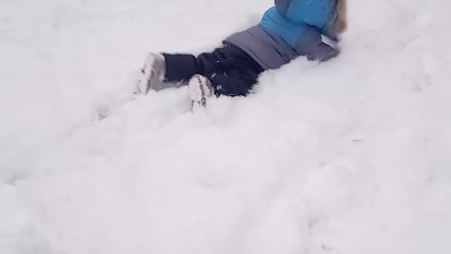 A child falls into the snow