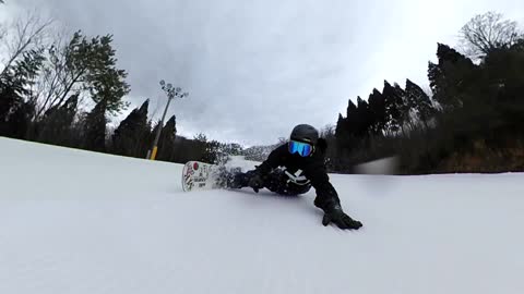 Professional Snowboarder Was Going Smoothly With His Side Body On Snow