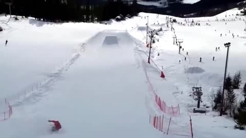 Snow Skier Jumps Way Too High Then Misses His Landing as His Friend Yells