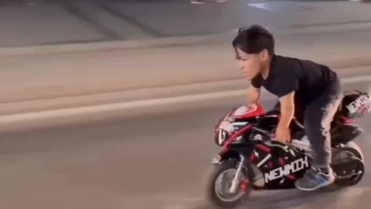 midget riding a mini bike