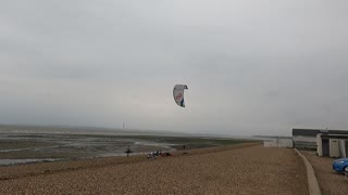 Raising a kite. Kite surfing.