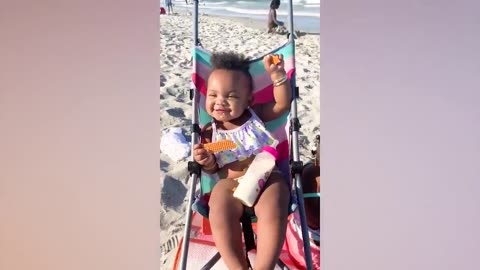 Funny Baby's Reaction On The Beach