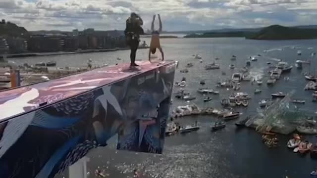 257 Handstand dive off the Oslo Opera House rooftop 🤯