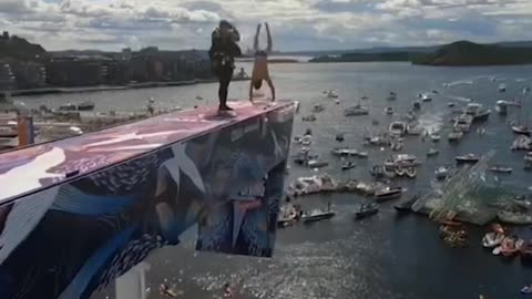 257 Handstand dive off the Oslo Opera House rooftop 🤯