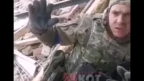 Russians paratroopers take Ukrainian soldiers prisoner.
