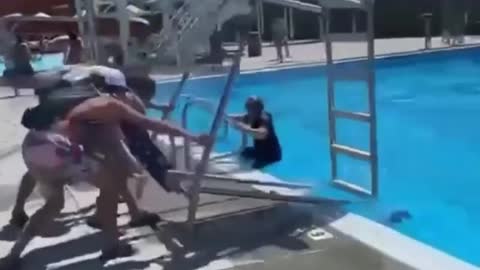 Group of men dropped Referee into the swimming pool