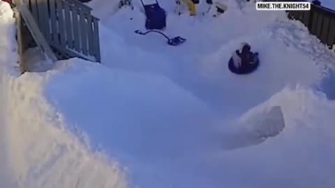 Dad Builds Snow Slide