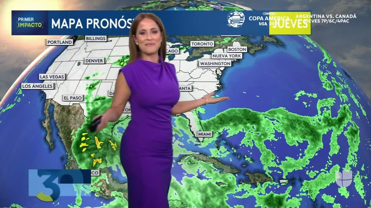 Jackie Guerrido delivers the weather forecast, wearing a purple dress with a split on the leg!